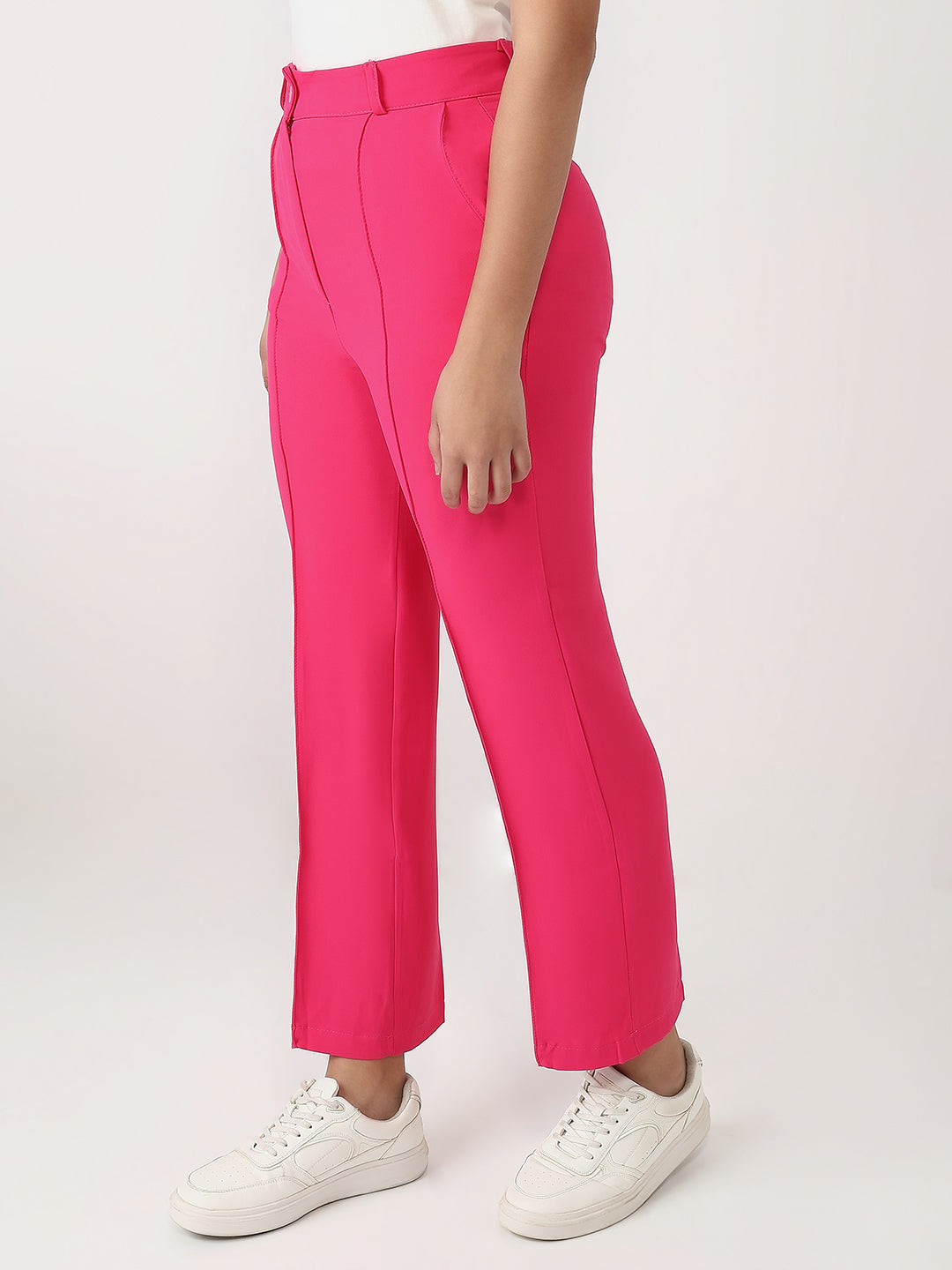 Bold and vibrant hot pink polyester trousers. Tailored for a flattering high-rise fit
