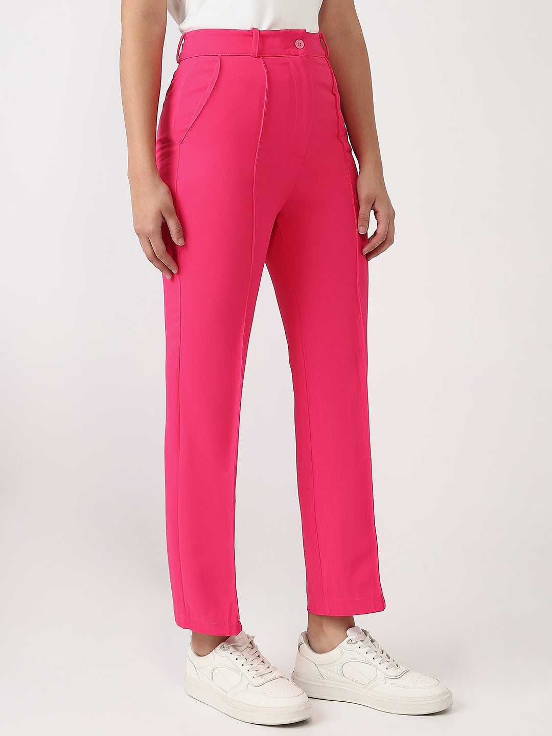 Bold and vibrant hot pink polyester trousers. Tailored for a flattering high-rise fit