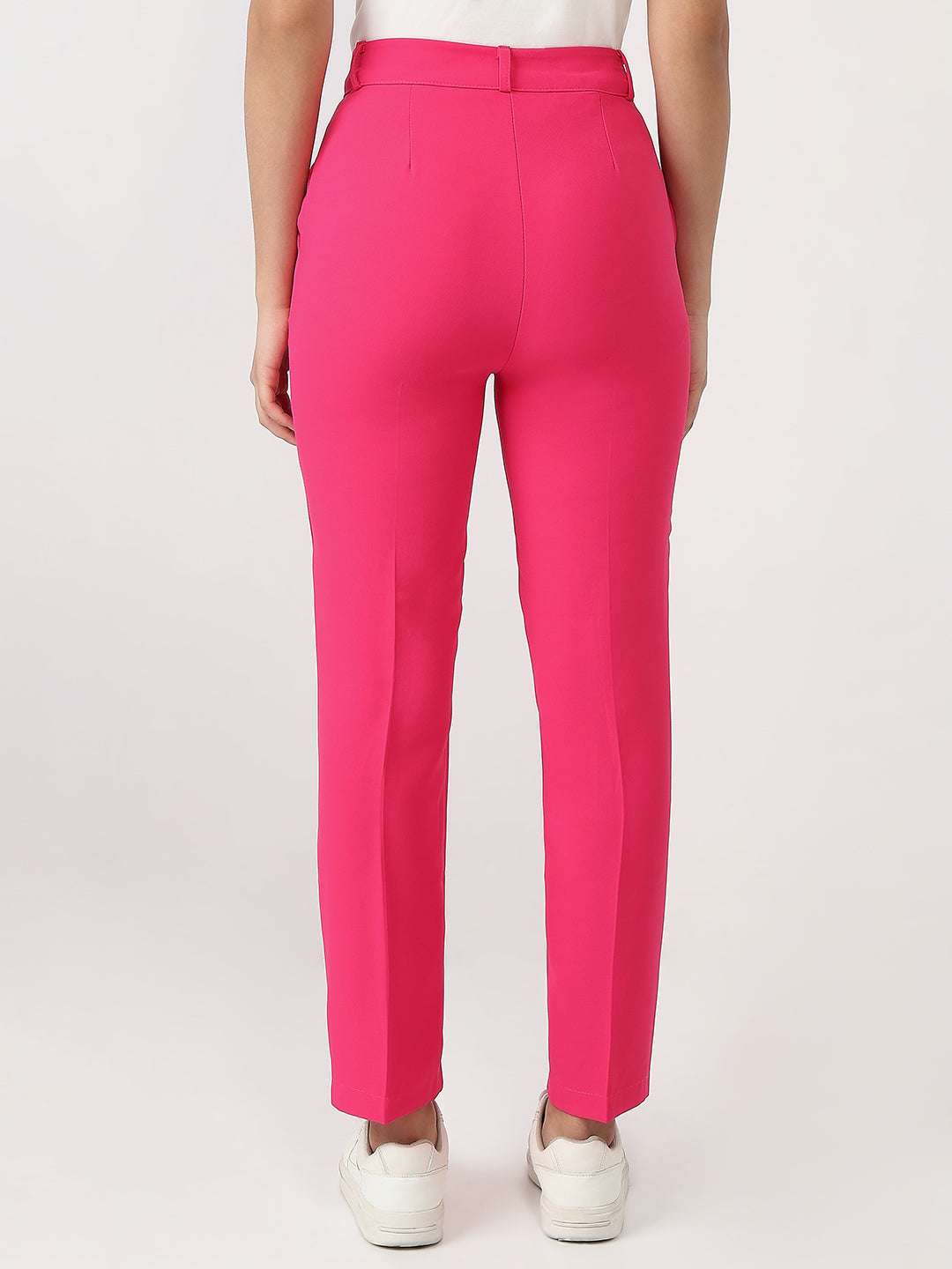Bold and vibrant hot pink polyester trousers. Tailored for a flattering high-rise fit