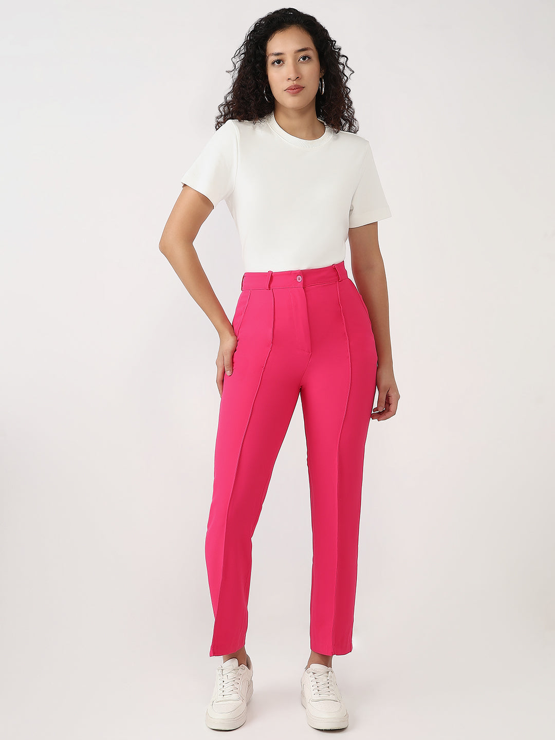 Bold and vibrant hot pink polyester trousers. Tailored for a flattering high-rise fit