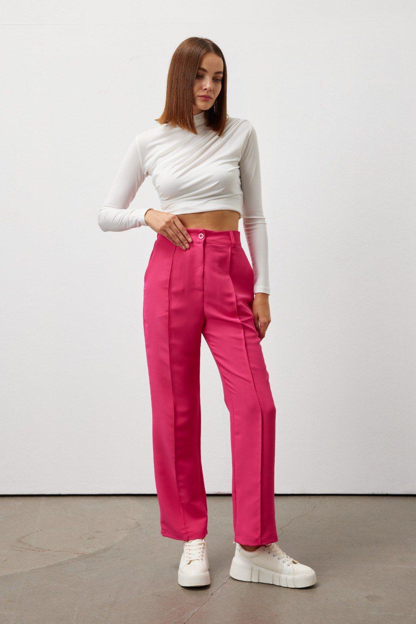Bold and vibrant hot pink polyester trousers. Tailored for a flattering high-rise fit