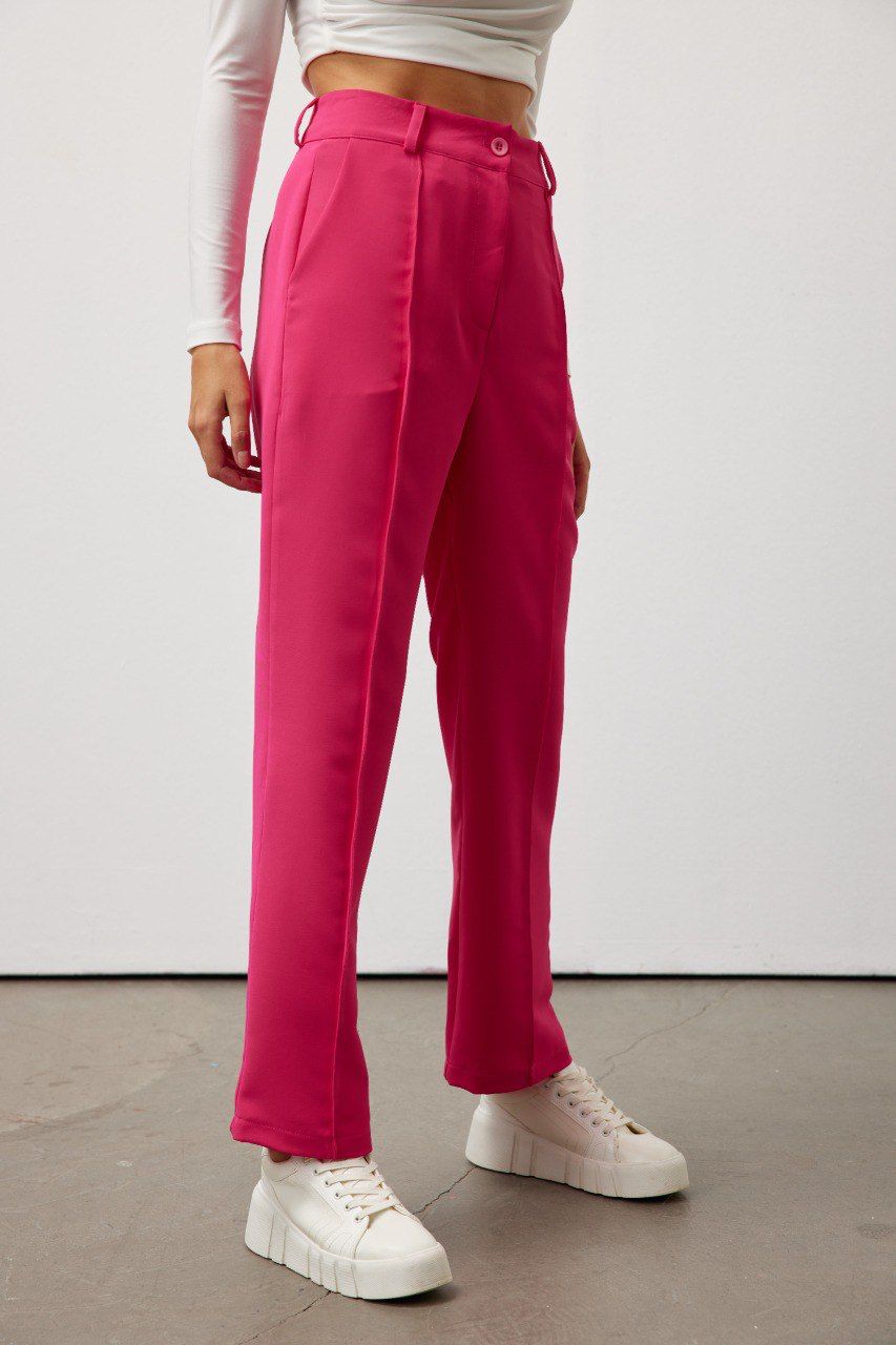 Bold and vibrant hot pink polyester trousers. Tailored for a flattering high-rise fit