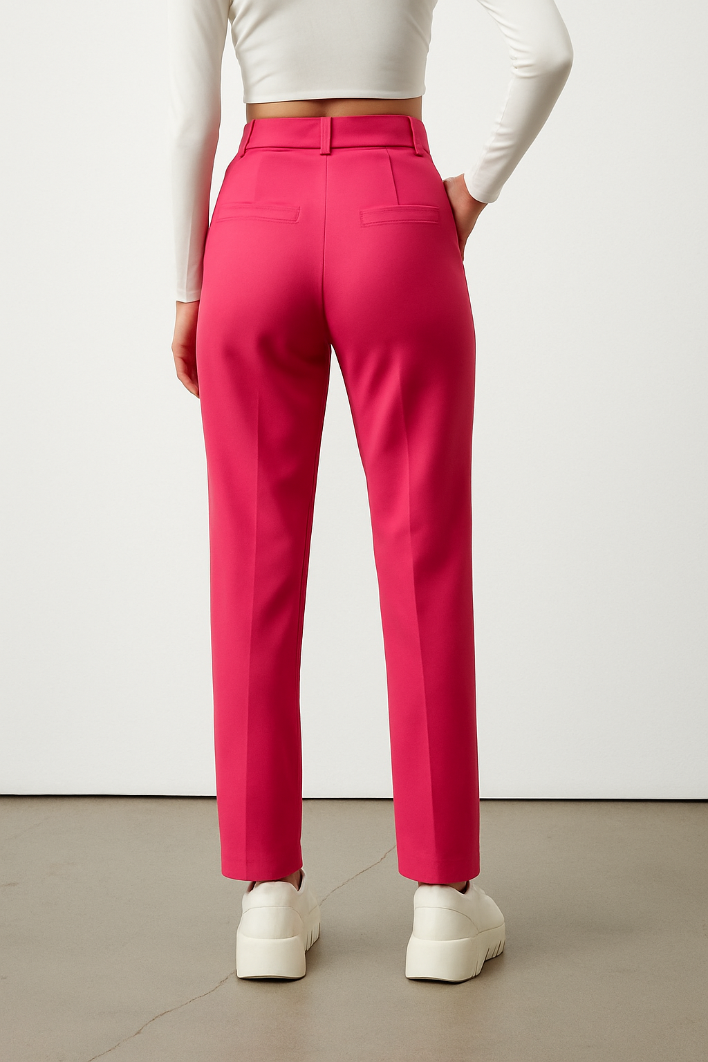 Bold and vibrant hot pink polyester trousers. Tailored for a flattering high-rise fit