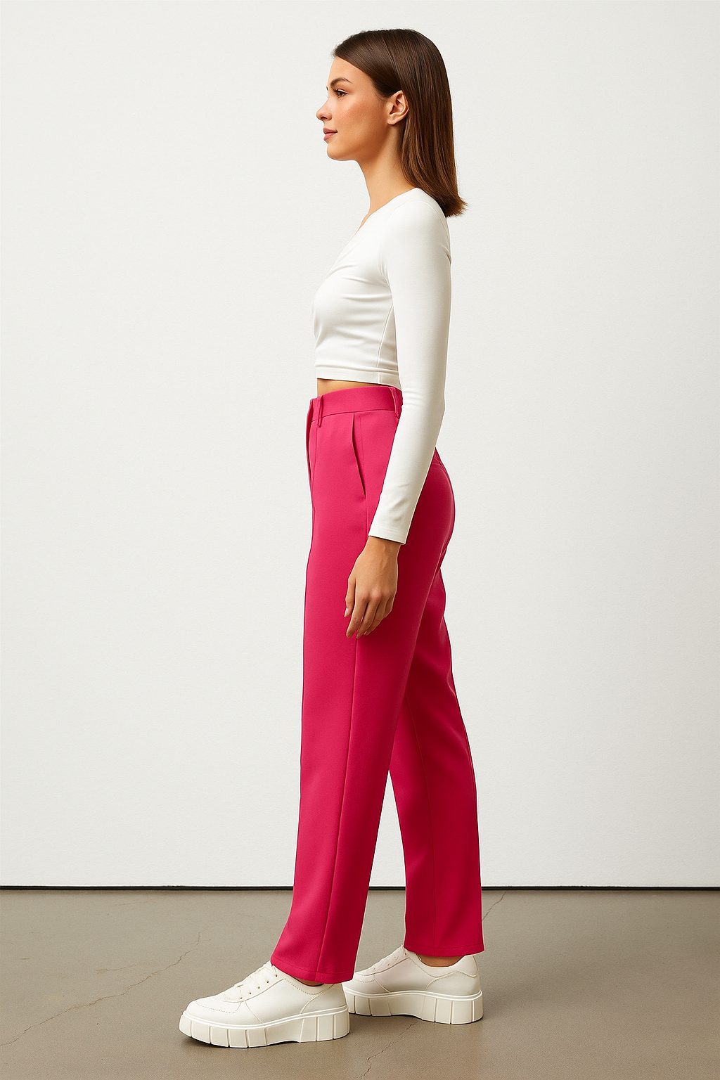 Bold and vibrant hot pink polyester trousers. Tailored for a flattering high-rise fit
